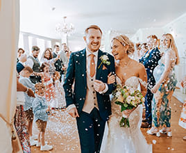 Parklands Quendon Hall Mollie and Terry in wedding confetti